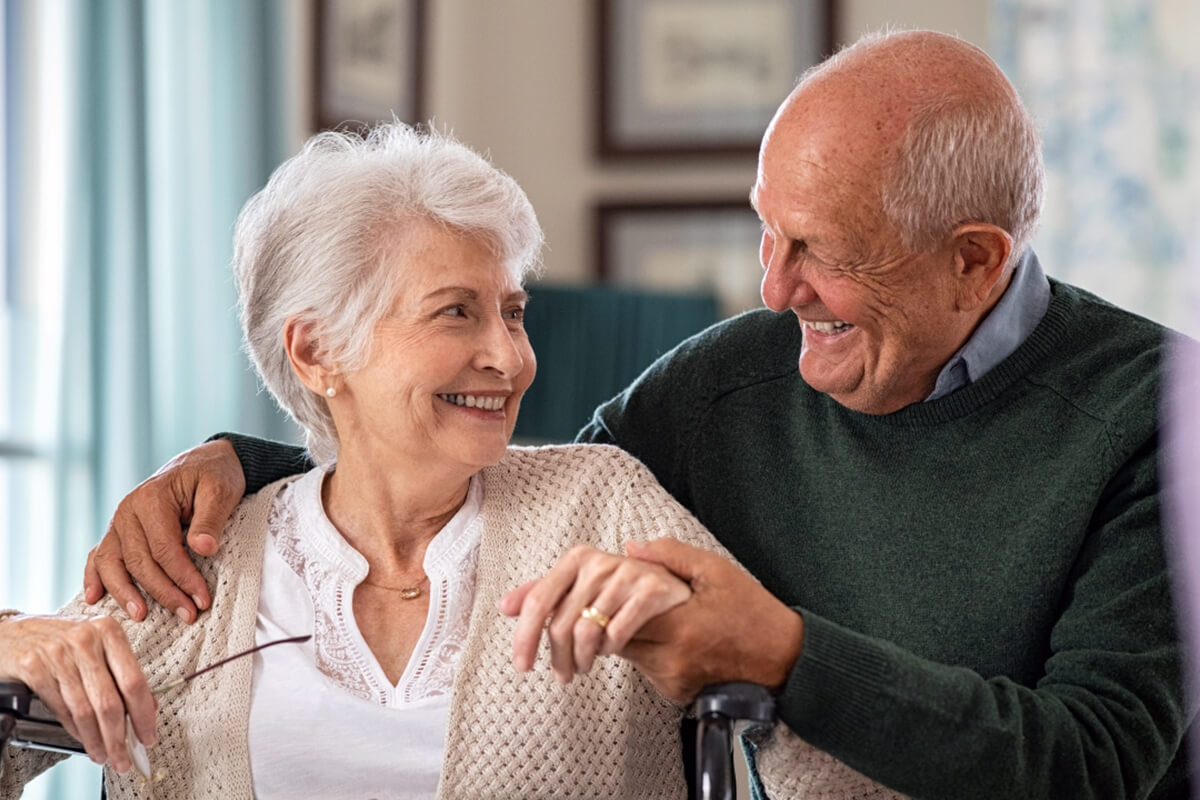 Older Couple smiling about investing with The Williams Law firm.